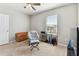 Bedroom with a ceiling fan, a comfy chair, and guitar equipment at 10741 Charlotte Dr, Parrish, FL 34219