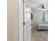 Bedroom featuring a bed with gray bedding, a ceiling fan and a mounted TV at 10741 Charlotte Dr, Parrish, FL 34219