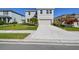 Well-maintained two-story home featuring a two-car garage and landscaping at 10741 Charlotte Dr, Parrish, FL 34219