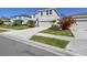 Exterior view of a two-story home with well-maintained landscaping and lawn at 10741 Charlotte Dr, Parrish, FL 34219