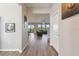 Inviting foyer with wood flooring leading to a spacious living area and staircase at 10741 Charlotte Dr, Parrish, FL 34219