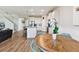 Open floor plan boasts a kitchen with white cabinets, an island with bar seating, and stainless steel appliances at 10741 Charlotte Dr, Parrish, FL 34219