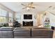 Comfortable living room with plenty of natural light, a ceiling fan, and a large sectional couch at 10741 Charlotte Dr, Parrish, FL 34219