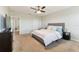 Spacious main bedroom with a ceiling fan, carpet flooring and large windows at 10741 Charlotte Dr, Parrish, FL 34219