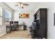 Bright office space featuring wood floors, a ceiling fan, natural light, and two desks at 10741 Charlotte Dr, Parrish, FL 34219