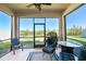 Screened-in patio featuring comfortable seating and views of the backyard at 10741 Charlotte Dr, Parrish, FL 34219