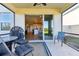 Covered patio area providing an outdoor living space, adjacent to the home's interior, with views of backyard at 10741 Charlotte Dr, Parrish, FL 34219
