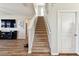 Inviting staircase with plush carpeting, leading to the upper levels of a naturally lit home at 10741 Charlotte Dr, Parrish, FL 34219