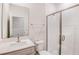 Bathroom boasts a modern walk-in shower with glass door and updated fixtures at 12160 Cattleside Dr, Riverview, FL 33579