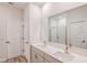 Modern bathroom featuring double sinks, quartz countertop, and walk-in shower at 12160 Cattleside Dr, Riverview, FL 33579