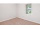 Bedroom with neutral carpet and a window with a view to the street at 12160 Cattleside Dr, Riverview, FL 33579