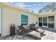 Charming backyard patio with modern lounge chairs, perfect for outdoor relaxation and entertaining at 1221 Dustin Rd, North Port, FL 34288