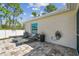 Inviting backyard patio featuring comfortable lounge chairs and a serene outdoor space at 1221 Dustin Rd, North Port, FL 34288