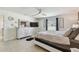 Bedroom features tile flooring, ceiling fan, natural light, and a spacious layout at 1221 Dustin Rd, North Port, FL 34288
