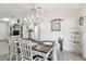 Well-lit dining area with modern chandelier, decor, and easy access to living spaces at 1221 Dustin Rd, North Port, FL 34288