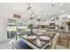Open dining area adjacent to kitchen, featuring modern lighting and access to the backyard patio at 1221 Dustin Rd, North Port, FL 34288