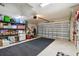 Well-organized garage space with shelving, storage containers, and space for parking a vehicle at 1221 Dustin Rd, North Port, FL 34288