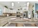 The open kitchen has a large island, stainless steel appliances, and granite countertops at 1221 Dustin Rd, North Port, FL 34288