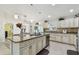 Bright kitchen with granite countertops, stainless steel appliances and white cabinets at 1221 Dustin Rd, North Port, FL 34288