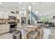 Bright kitchen featuring a spacious island, granite countertops, and stainless steel appliances at 1221 Dustin Rd, North Port, FL 34288