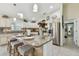 Bright kitchen island with granite countertops, stainless steel appliances, and bar seating at 1221 Dustin Rd, North Port, FL 34288