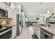 Open-concept kitchen flows into the living room, creating a welcoming and spacious atmosphere at 1221 Dustin Rd, North Port, FL 34288