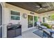 Cozy screened lanai with stylish furniture and peaceful views of the outdoor space at 1221 Dustin Rd, North Port, FL 34288