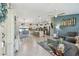 Open-concept living space featuring tile floors, kitchen island, and plenty of natural light at 1221 Dustin Rd, North Port, FL 34288
