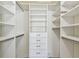 This walk-in closet includes an array of shelves, drawers, and hanging storage solutions at 1221 Dustin Rd, North Port, FL 34288