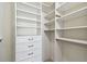 Custom walk-in closet with a combination of shelving, drawers, and hanging storage space at 1221 Dustin Rd, North Port, FL 34288