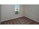 Bedroom with neutral walls and carpet featuring a window with a view at 14777 Summer Branch Dr, Lithia, FL 33547