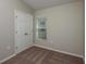 Bedroom featuring plush carpet, window, and closet with double doors at 14777 Summer Branch Dr, Lithia, FL 33547