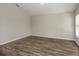 Neutral bedroom showcasing hardwood floors, ample wall space, and natural light at 14777 Summer Branch Dr, Lithia, FL 33547