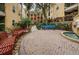 The condo has a courtyard with benches, walkways and landscaping at 1810 E Palm Ave # 5222, Tampa, FL 33605