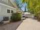 Exterior view showcasing a brick patio, lush greenery, and a well-maintained home with classic design at 1825 S 2Nd Street, St Petersburg, FL 33705