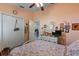 Cozy bedroom with floral bedding, charming decor, and a bright, inviting ambiance at 19826 Wyndham Lakes Dr, Odessa, FL 33556