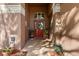 Inviting front entryway with red door, brickwork, and decorative plants at 19826 Wyndham Lakes Dr, Odessa, FL 33556