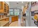 Functional kitchen with tile flooring, plenty of counter space, and views to the backyard at 19826 Wyndham Lakes Dr, Odessa, FL 33556