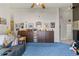 Comfortable living room with cozy seating, a ceiling fan, and well-organized decor at 19826 Wyndham Lakes Dr, Odessa, FL 33556