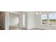 Bright living room with hardwood floors, neutral walls, and large windows at 1988 Webbstone Way, Zephyrhills, FL 33541