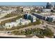 Aerial image shows buildings with landscaping and a waterfront view, offering a unique urban living experience at 201 W Laurel St # 811, Tampa, FL 33602