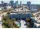 A scenic aerial view of a high-rise building with a pool and beautiful city skyline in the background at 201 W Laurel St # 811, Tampa, FL 33602