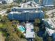 Aerial view of a building with a pool area, showcasing the building amenities with city views at 201 W Laurel St # 811, Tampa, FL 33602