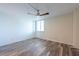 Bedroom featuring wood-look floors, ceiling fan, and a window that provides plenty of natural light at 201 W Laurel St # 811, Tampa, FL 33602