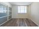 Bedroom featuring wood-look floors, and a sliding door closet system at 201 W Laurel St # 811, Tampa, FL 33602
