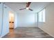 Bedroom featuring wood-look floors, ceiling fan, and a window that provides plenty of natural light at 201 W Laurel St # 811, Tampa, FL 33602