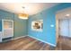 Dining room with wood-look floors offers a view of the kitchen area at 201 W Laurel St # 811, Tampa, FL 33602