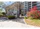 Gated entry to the condos with vibrant flowers and lush landscaping at 201 W Laurel St # 811, Tampa, FL 33602