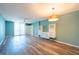 Living room with wood floors, ceiling fan, and a sliding door to a balcony at 201 W Laurel St # 811, Tampa, FL 33602
