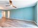 Spacious living room featuring wood-look floors and a modern ceiling fan at 201 W Laurel St # 811, Tampa, FL 33602